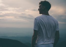 man looking over mountain