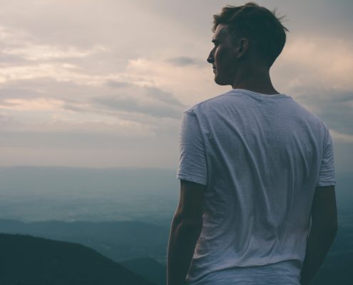 man looking over mountain
