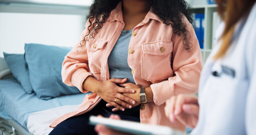 Woman with chronic illness meeting with a doctor.