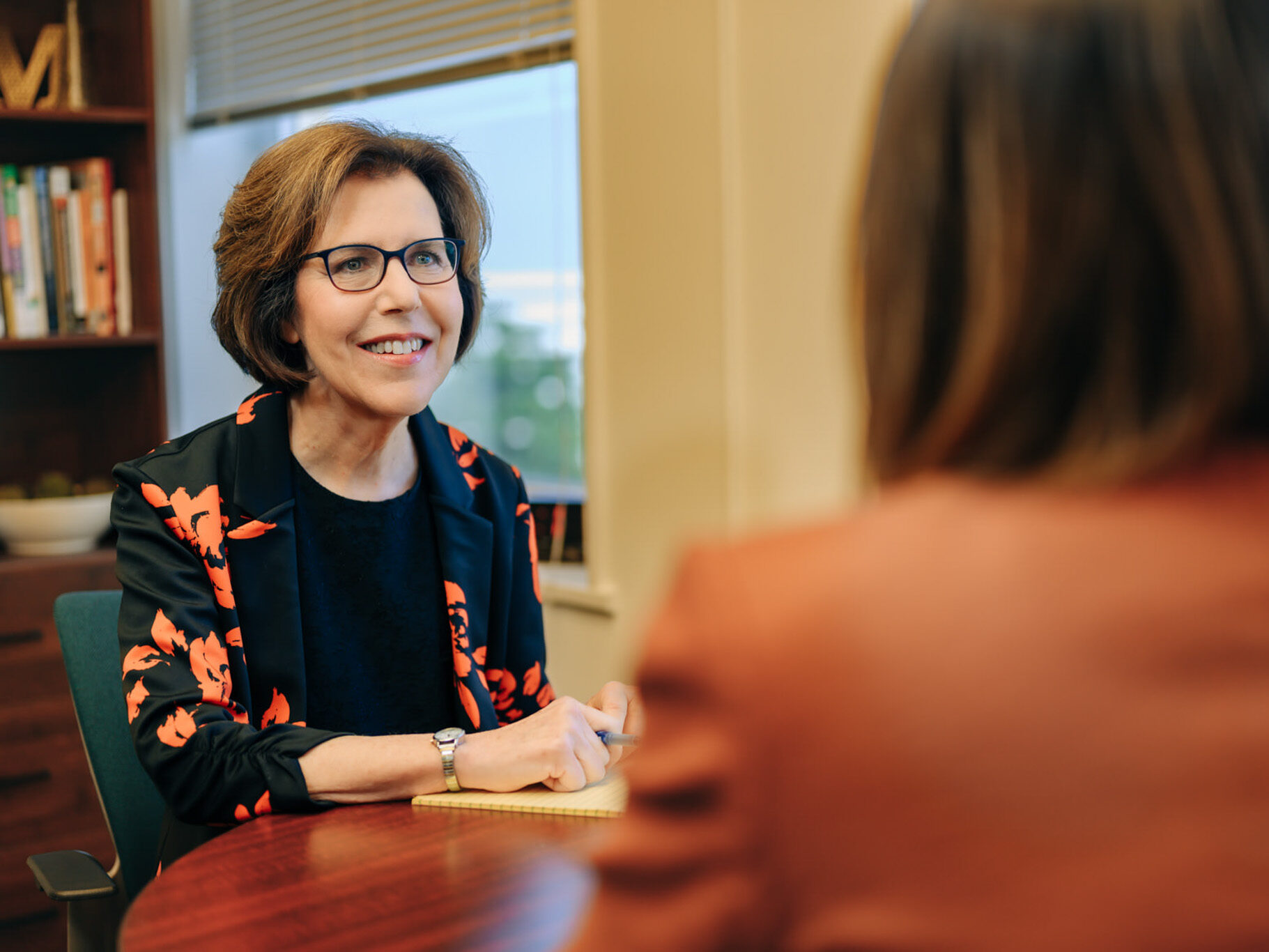 A psychologist in session with a female client